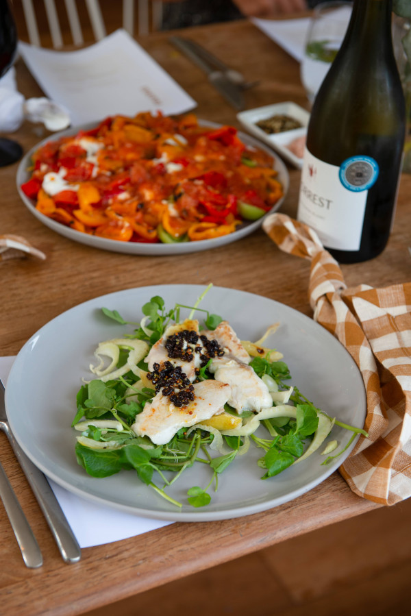 On the menu for the dish Club: Market Fish with Rocket, Fennel, Preserved Lemon and Currant Salad and Tomato and Roasted Capsicum Salad with Tomato and Smoked Paprika Dressing, both from Issue #101.