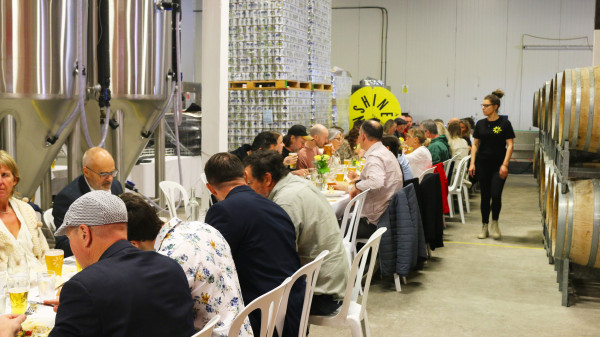people enjoying Sunshine brewing's 33rd anniversary luncheon