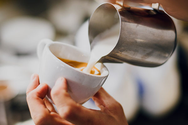 barista making coffee